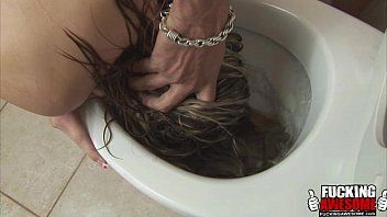 Play After she finishes sucking his cock, he puts her head in the toilet